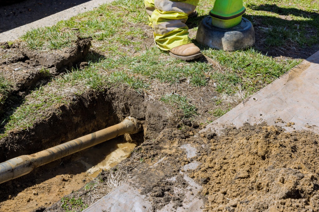 Close view of a plumbing pipe being serviced using a trenchless method.